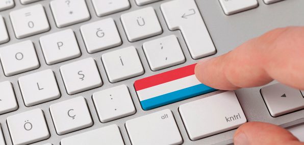 Touche de clavier représentant le drapeau du Luxembourg, illustrant le travail transfrontalier